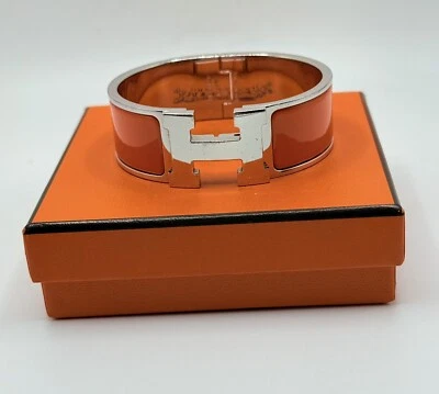 Brazalete Hermes Firmado Naranja Esmalte .75 In Ancho Clic Clac H Plata Paladio Foto 1 de 4