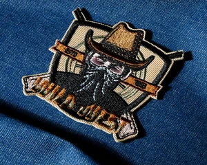 Wild West Bandit Iron-On Patch – Cowboy Hat & Bearded Outlaw Design (7 x 7cm) - Picture 1 of 3