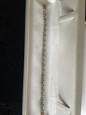 Pulsera estilo tenis esterlina para mujer de 8" con gemas de color topacio azul claro Foto 1 de 4