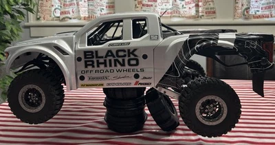 Camión Losi 1/10 Baja Rey 2.0 4x4 Desert negro carrocería Rhino ruedas de aluminio usado Foto 1 de 4