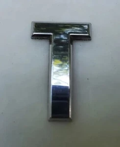 Infiniti Emblem Symbol Sign Badge Logo Ornament Oem Genuine Factory Letter "T" - Picture 1 of 4