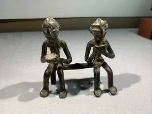 Vintage Cast Iron African Tribal Men Sitting On A Bench With Bowls - Picture 1 of 7