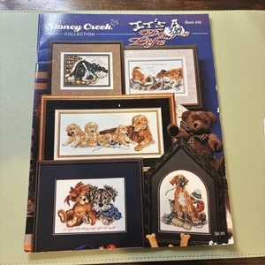 Libro de colección Stoney Creek con patrón de punto de cruz It's A Dog's Life 242 cachorros - Imagen 1 de 2