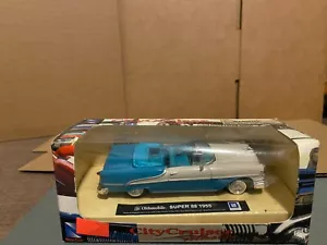 1/43 NUEVO RAY 1955 OLDSMOBILE SUPPER 88 CONVERTIBLE AZUL Y BLANCO - Imagen 1 de 6