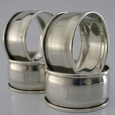 FOUR ENGLISH STERLING SILVER ENGINE TURNED NAPKIN RINGS 1959