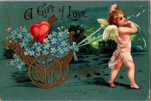 AK Geschenk der Liebe Amor Ziehwagen mit Herz geteilter Rückseite gestempelt 1910 - Bild 1 von 2