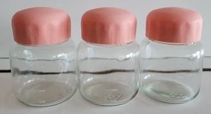 3 ROUND CLEAR GLASS CANISTER JARS PLASTIC PEACH TWIST ON CAPS 4 INCHES 10 OZS - Picture 1 of 8