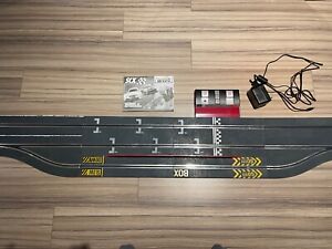 SCX WOS Powerbase unit and pitstop 1/32 slot car