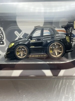 YM Modelo X Q CAR Subaru Impreza WRX STI Voltex Negro Oro Resina 1:64 Foto 1 de 4