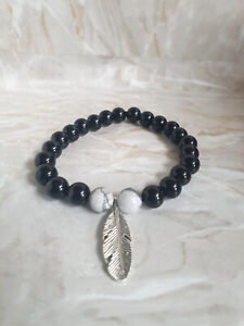 Black onyx and White Howlite With Feather Charms Bracelet