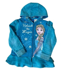 Disney Frozen Elsa Kapuzenpullover mit Reißverschluss Kind Größe 6 Rüschen unten "Unleash The Magic" - Bild 1 von 6