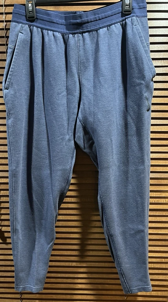 Calça jogger masculina Nike Dri-Fit ioga tamanho médio azul CZ2208-068 - Imagem 1 de 4