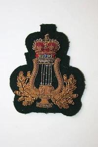 INSIGNIA ORIGINAL DE CALIFICACIÓN DE ALAMBRE DORADO ROYAL MARINES BANDSMAN EN VERDE LOVAT - Imagen 1 de 1