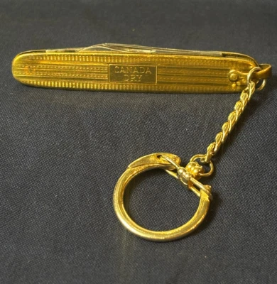 Cuchillo Colonial Canadá Publicidad Seca Doble Hoja Plegable Cuchillo de Bolsillo Llavero De Colección Foto 1 de 4