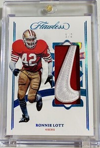 Ronnie Lott 1/2 Nike Swoosh Patch 2022-23 Panini Flawless Football Card