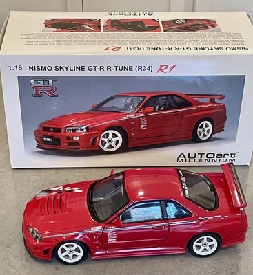 AUTOart Millennium Nissan Skyline GT‑R (R34) NISMO R‑Tune Red [77357] 1:18 - Image 1 of 4