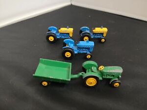 O358-MATCHBOX LESNEY LOT OF FOUR FORD TRACTORS AND ONE TRAILER