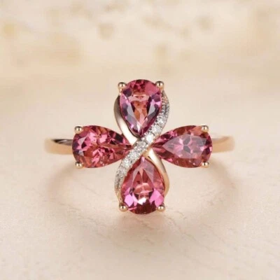 Anillo de cuatro piedras con diamantes de zafiro creado en laboratorio de peras de 2,30 quilates enchapado en oro rosa de 14 quilates Foto 1 de 4