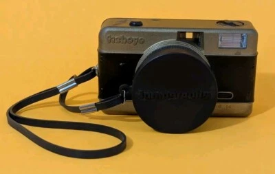 LOMOGRAPHY FISHEYE 35mm CAMERA, w/ Front Cap. Built-In Flash Wood grain - Image 1 of 4