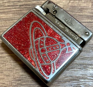 Encendedor de gas Vivienne Westwood en funcionamiento plata rojo orbe sin caja - Imagen 1 de 6