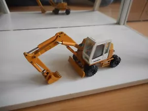 Conrad Excavator Liebherr 310 in Dark Yellow on 1:50 - Picture 1 of 2