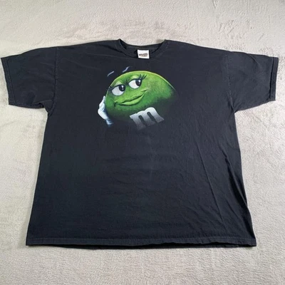 Camisa De Colección M&Ms Mundo Personaje Verde Para Hombres 2XL Negra Gráfica Caramelo Novedad Foto 1 de 4