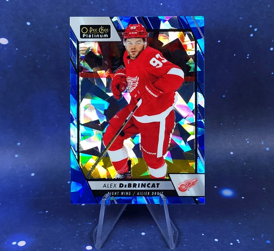 Alex DeBrincat /125 2023-24 OPC Platinum Blue Fragment Red Wings O Pee Chee - Image 1 of 4