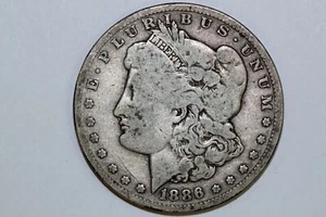 Grades Very Good 1886 O Morgan 90% Silver Dollar (MDX2519) - Picture 1 of 10