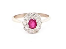 A ruby and diamond cluster ring size M 1/2