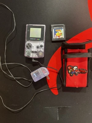 Sistema portátil Game Boy Color - Púrpura atómico + Juego Pac Man + Estuche Mario Foto 1 de 3