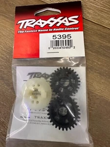 Traxxas® TRA5395 Engranajes de salida, adelante y atrás/transporte para perros Revo Nuevo en caja - Imagen 1 de 1