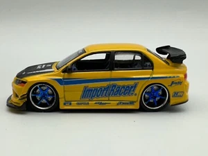 Jada Toys Diecast Import Racer Mitsubishi Lancer Evolution, Yellow, 1:64 - Picture 1 of 11