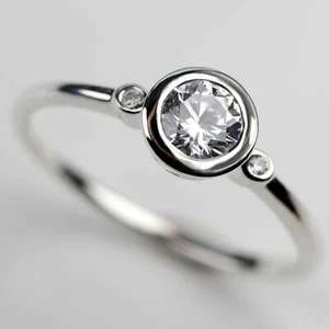0.9 TCW Round Moissanite Three Stone Bezel Engagement Ring 14k White Gold Plated - Picture 1 of 11