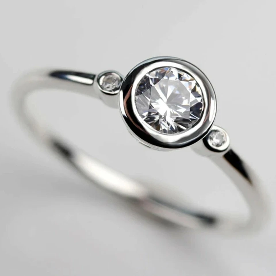 0.9 TCW Round Moissanite Three Stone Bezel Engagement Ring 14k White Gold Plated - Image 1 of 4