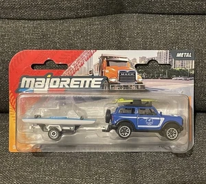 Modellino Majorette Ford Bronco, Rimorchio E 2 Canoe 1/64 Nuovo Scatola 2025 - Foto 1 di 5