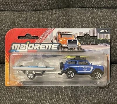 Modellino Majorette Ford Bronco, Rimorchio E 2 Canoe 1/64 Nuovo Scatola 2025 - Immagine 1 di 4