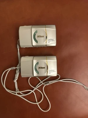 Two Nikon Lite Touch Zoom 140 Ed AF For Parts READ - Image 1 of 4