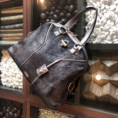 Bolso de Mano Yves Saint Laurent Muse Negro × Marrón Cuero Metálico Usado Foto 1 de 4