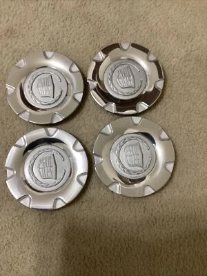 Cadillac SRX center cap 2004-2006 part number 9596275 02 silver chrome 4pcs - Image 1 of 4