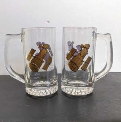 (2) Taza/piedra de cerveza de vidrio conmemorativo vintage Lockheed HUBBLE SPACE TELESCOPE Foto 1 de 4
