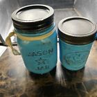 2 mason jar painted dark blue pint and half pint. AD