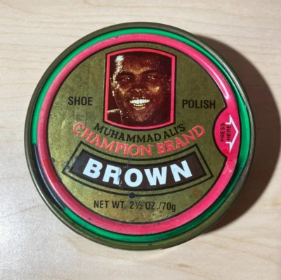 VINTAGE MUHAMMAD ALI'S (CASSIUS CLAY) CHAMPION BRAND BROWN SHOE POLISH - Image 1 of 3
