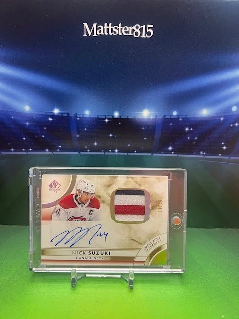 2023-24 UPPER DECK SP AUTHENTIC - NICK SUZUKI LIMITED AUTO MATERIAL PATCH 11/50 - Image 1 of 4