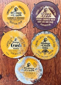 4 Different ORANGE CRUSH Bottle Cap Slugs & 1 Grape Crush Slug - Picture 1 of 2