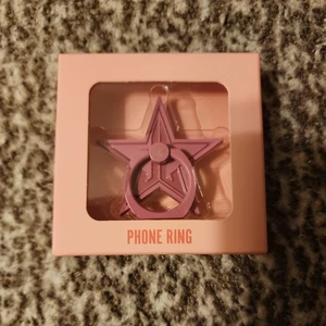 Bague téléphone Jeffree Star étoile rose neuve dans sa boîte - Photo 1 sur 2