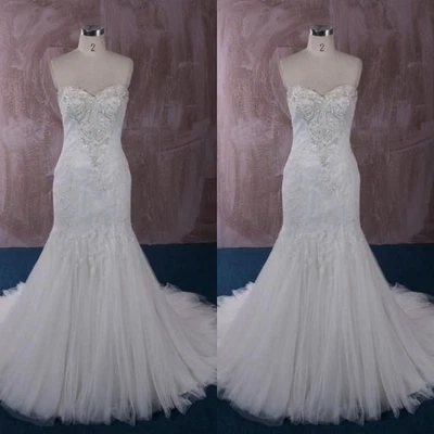 Vestidos de novia de sirena con cuentas blancas marfil elegantes vestidos de novia Foto 1 de 4
