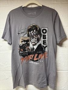John Carpenter's THEY LIVE Retro VHS Logo Fright Rags Herren Large Horror T-Shirt - Bild 1 von 5