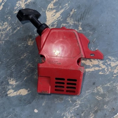 The red plastic part is a recoil starter assembly cover for a Poulan - Image 1 of 4