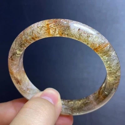 Brazalete de cristal de cuarzo Super 7 rutilado oro negro natural 55 mm AAAA Foto 1 de 4