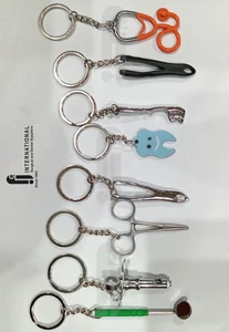 Juego de Llaveros Dentales Pinzas Espejo Jeringa Pinzas Estatoscopio Alta Calidad 8 un. - Imagen 1 de 2